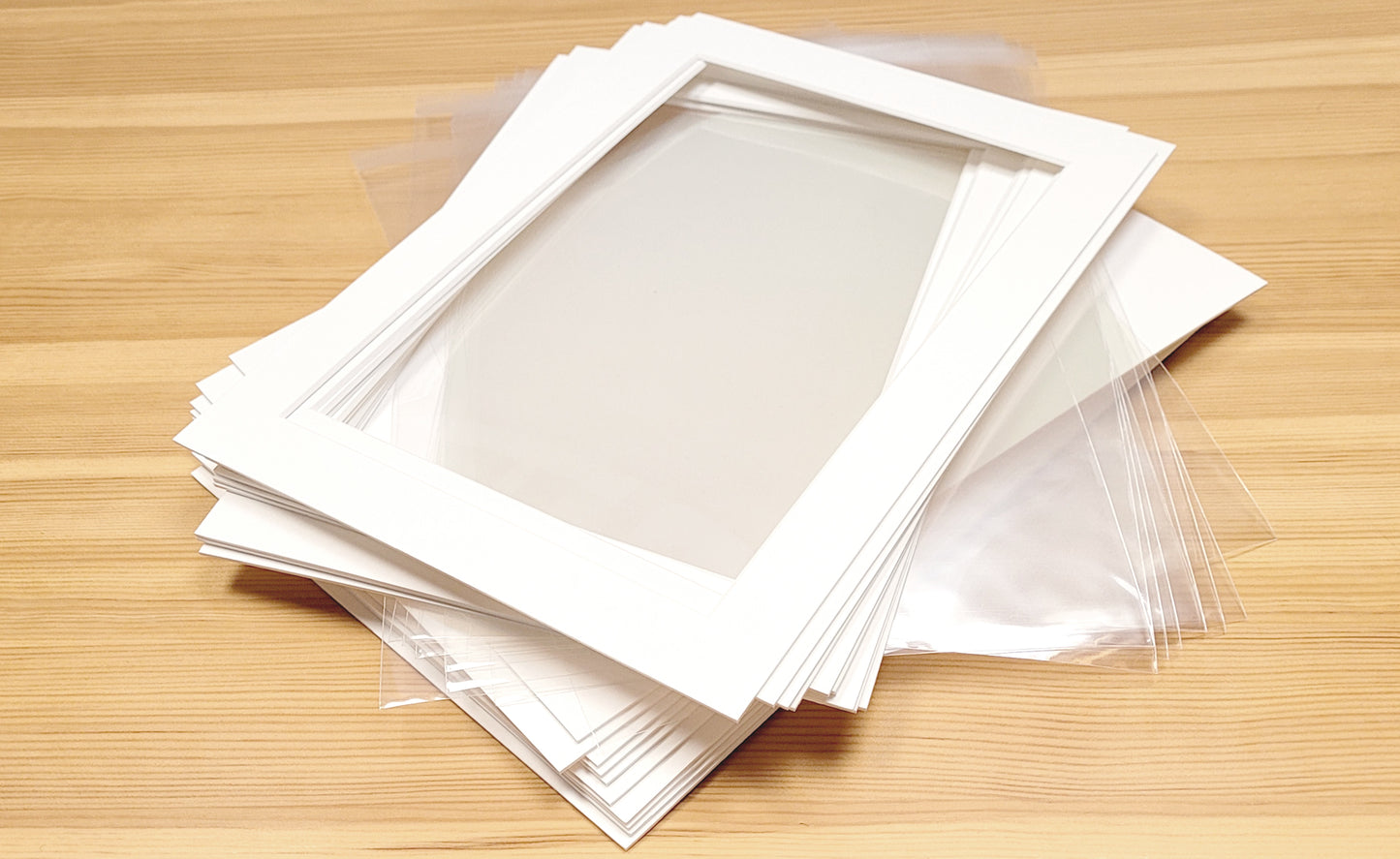 Pack of 10 picture photo mounts mats with backing boards and cellophane envelopes. Picture framing kits in standard frame sizes..