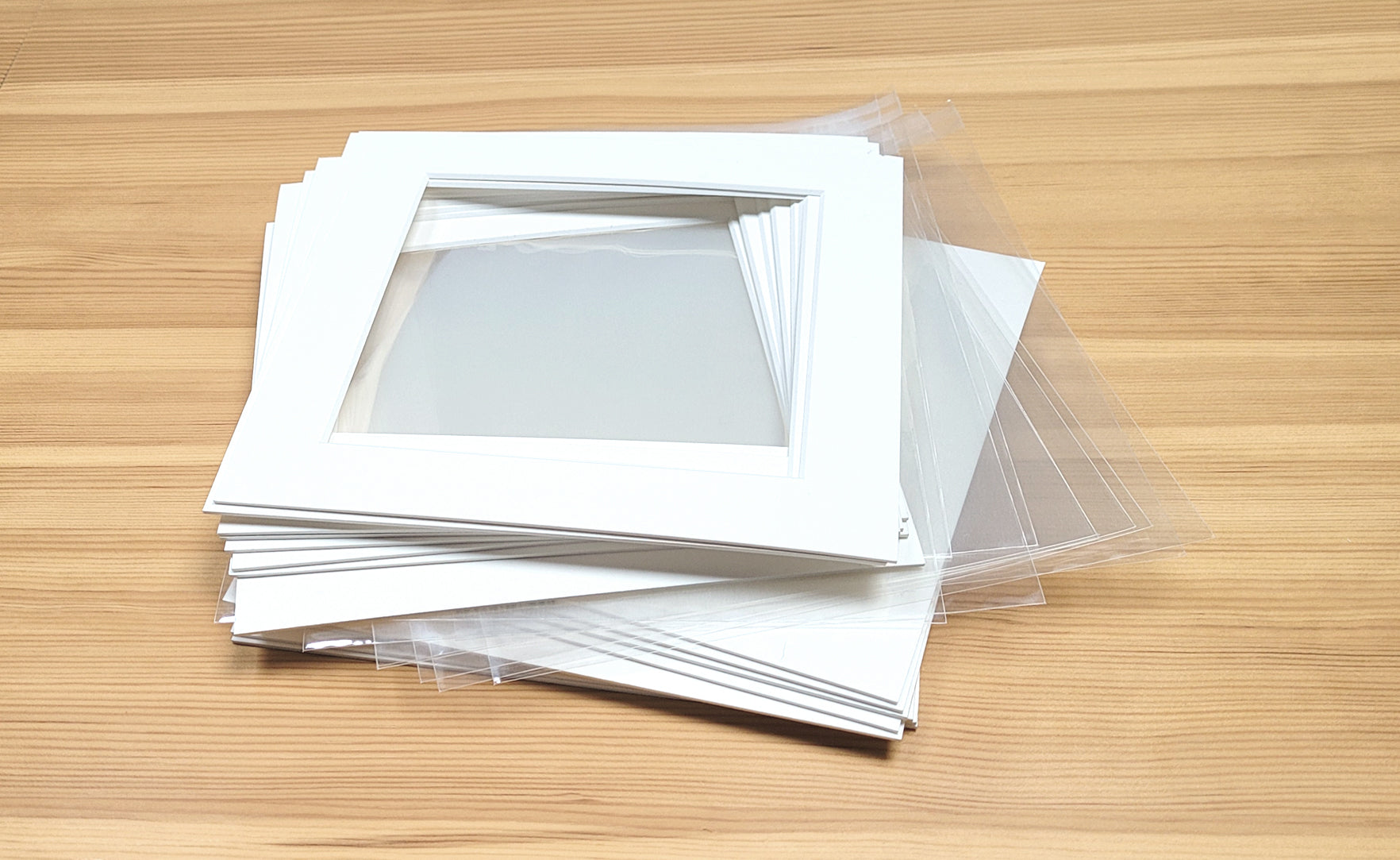 Standard square sizes of picture window photo mounts with backs and cellophane bags.