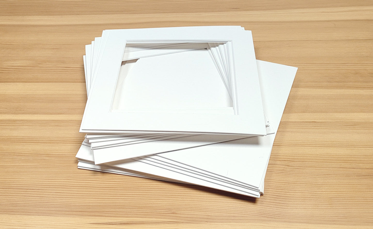 Picture window photo mounts with backing boards. Standard square sizes.